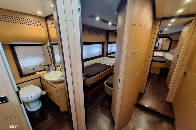  Yacht Photos Pics Luxurious interior of 2008 Pershing 72 yacht featuring modern bedroom and bathroom design.