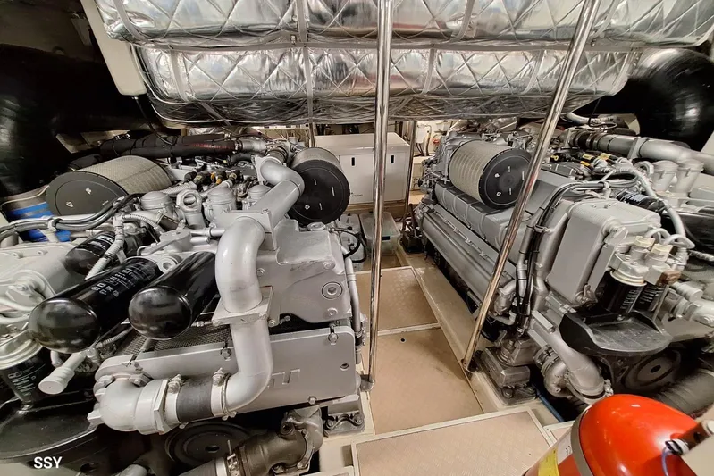  Yacht Photos Pics Engine room of a 2008 Pershing 72 yacht, showcasing dual powerful engines.