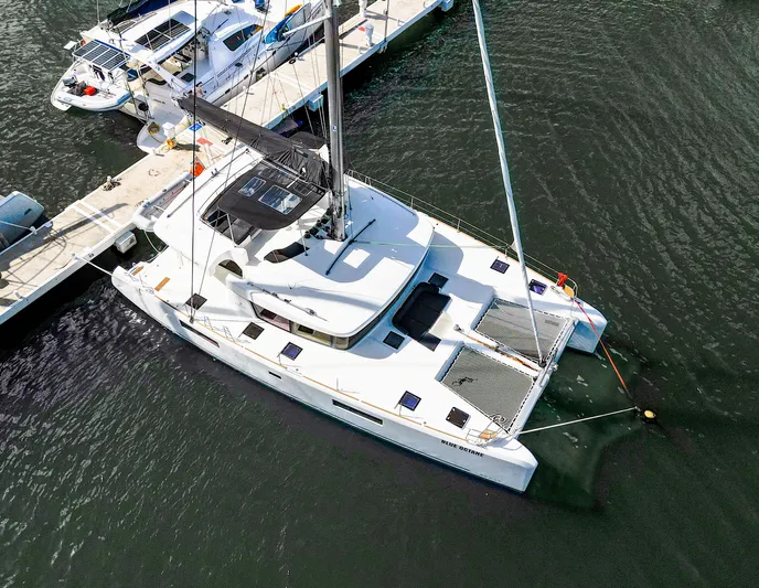 Blue Octane Yacht Photos Pics Aerial view of 2018 Lagoon 52 F catamaran docked at marina.
