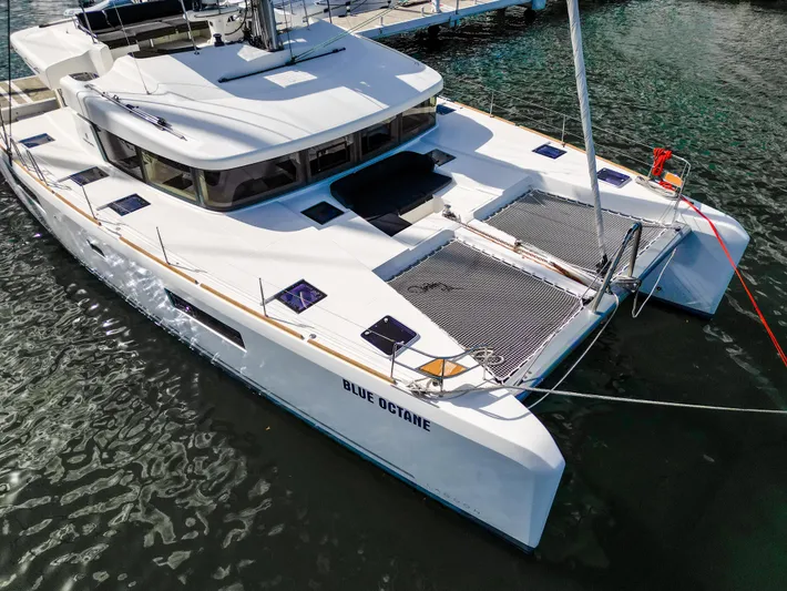 Blue Octane Yacht Photos Pics 2018 Lagoon 52 F catamaran docked, featuring spacious deck and modern design.