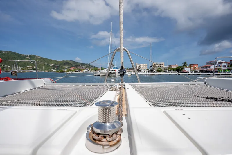 Blue Octane Yacht Photos Pics Lagoon 52 F catamaran deck view, 2018 model, in a scenic marina setting.