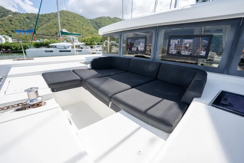 Blue Octane Yacht Photos Pics Luxurious 2018 Lagoon 52 F yacht with spacious outdoor seating and scenic marina view.
