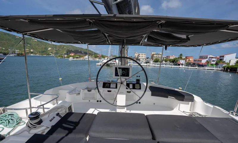 Blue Octane Yacht Photos Pics Helm of 2018 Lagoon 52 F catamaran with marina view in the background.