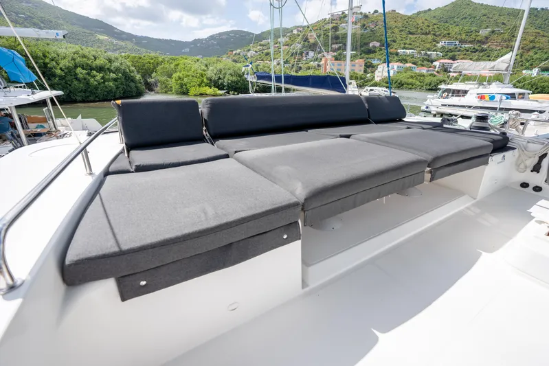 Blue Octane Yacht Photos Pics Luxurious seating area on a 2018 Lagoon 52 F yacht, surrounded by scenic greenery.