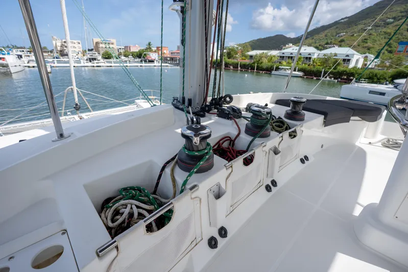 Blue Octane Yacht Photos Pics Cockpit of 2018 Lagoon 52 F yacht with winches and ropes, docked in marina.