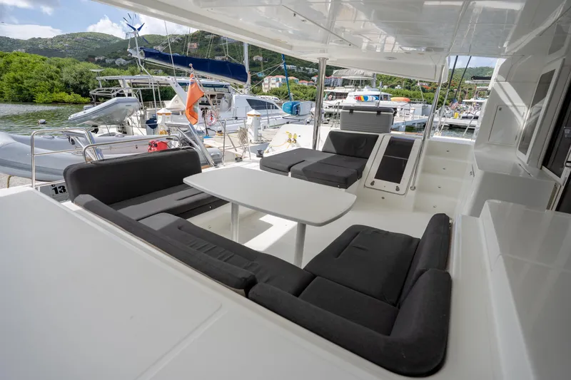 Blue Octane Yacht Photos Pics Spacious deck of 2018 Lagoon 52 F catamaran with comfortable seating and scenic marina view.