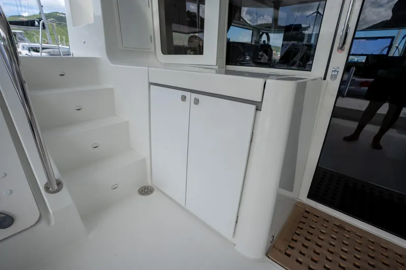 Blue Octane Yacht Photos Pics Interior view of 2018 Lagoon 52 F yacht, featuring stairs and sleek cabinetry.