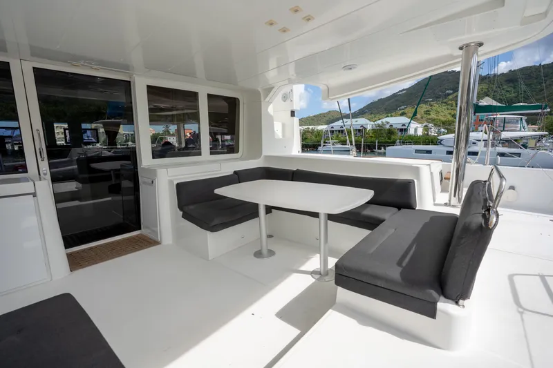 Blue Octane Yacht Photos Pics Spacious outdoor seating area on a 2018 Lagoon 52 F catamaran, featuring a sleek design.