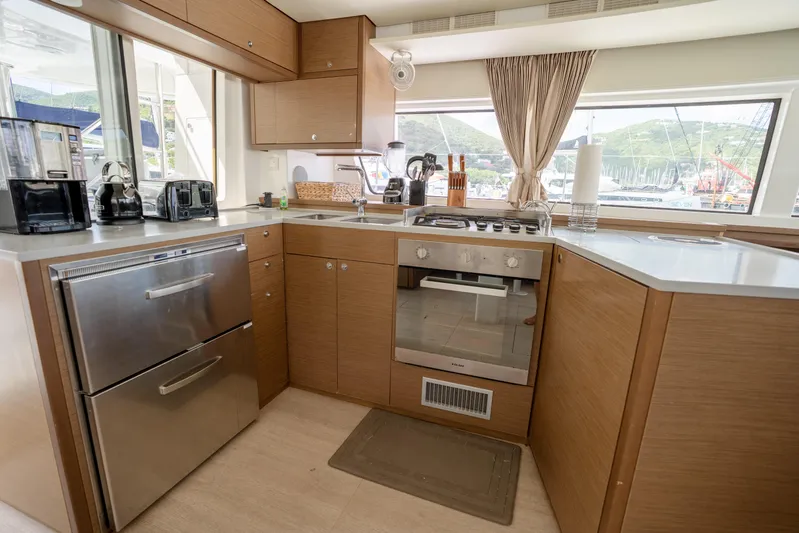 Blue Octane Yacht Photos Pics Modern kitchen interior on 2018 Lagoon 52 F yacht with appliances and scenic window view.