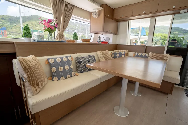 Blue Octane Yacht Photos Pics Luxurious interior of 2018 Lagoon 52 F yacht with cozy seating and elegant decor.