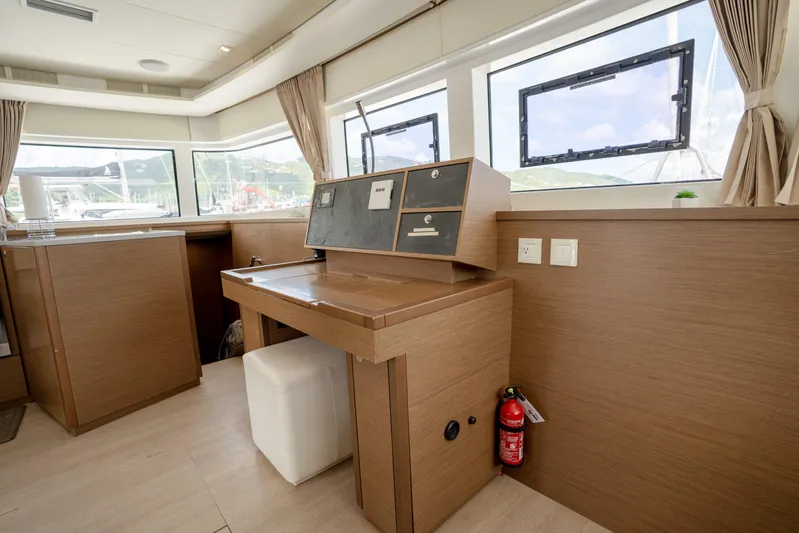 Blue Octane Yacht Photos Pics Interior of 2018 Lagoon 52 F yacht with navigation station and large windows.