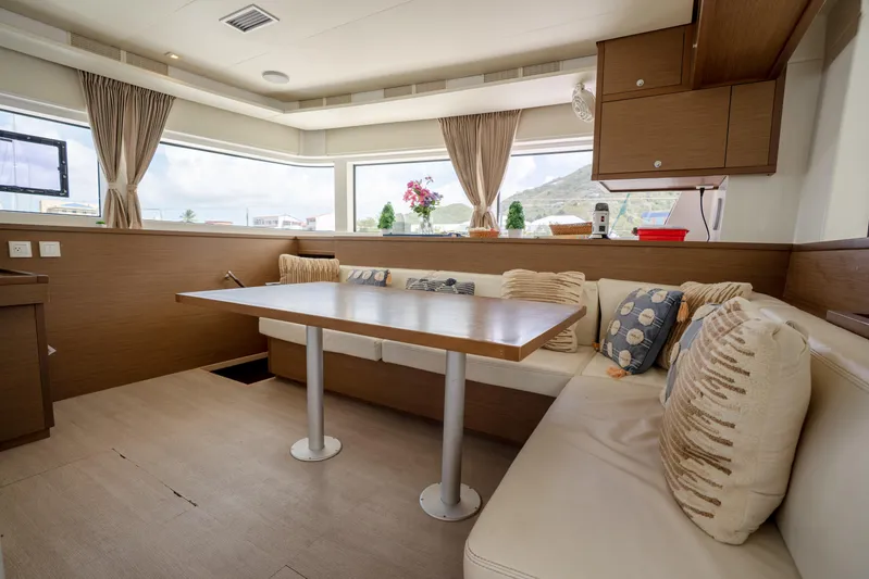 Blue Octane Yacht Photos Pics Luxurious interior of 2018 Lagoon 52 F yacht with elegant seating and panoramic windows.