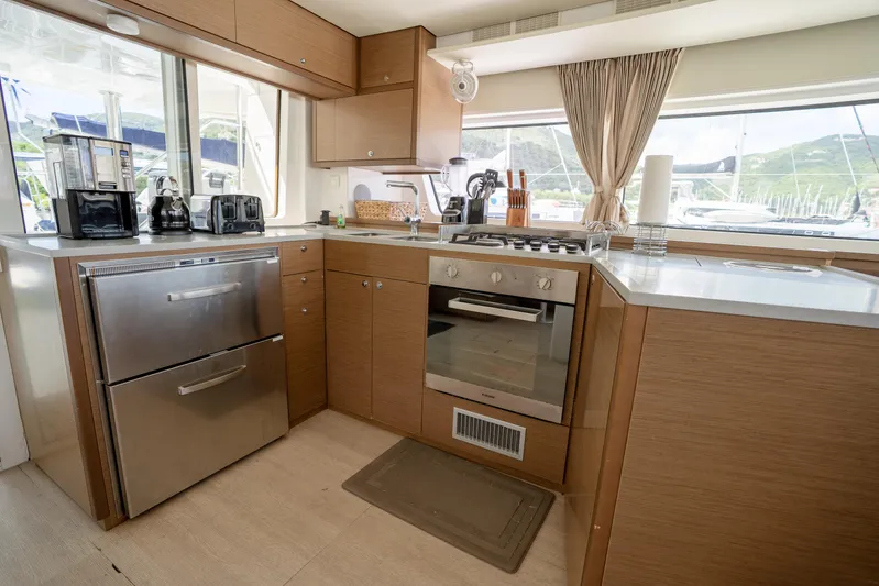 Blue Octane Yacht Photos Pics Modern kitchen interior on 2018 Lagoon 52 F yacht with appliances and scenic window view.