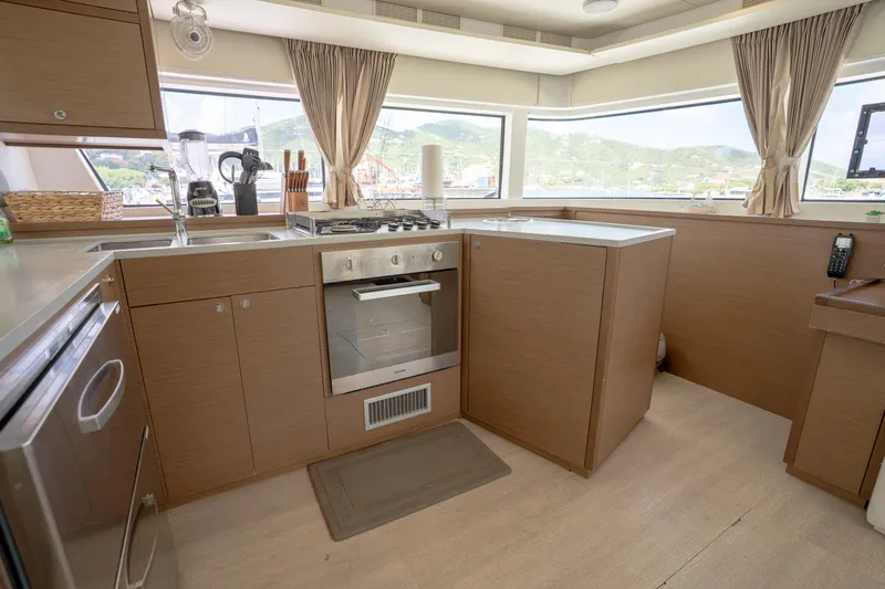 Blue Octane Yacht Photos Pics Modern kitchen interior on 2018 Lagoon 52 F yacht with appliances and panoramic windows.