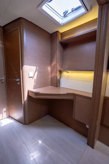 Blue Octane Yacht Photos Pics Interior of 2018 Lagoon 52 F yacht with wooden cabinetry and skylight.