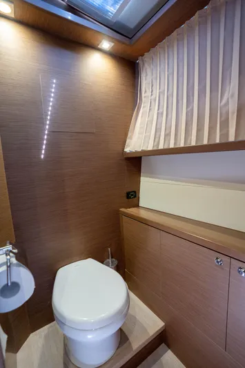 Blue Octane Yacht Photos Pics Luxurious bathroom in 2018 Lagoon 52 F yacht with modern wood finish.