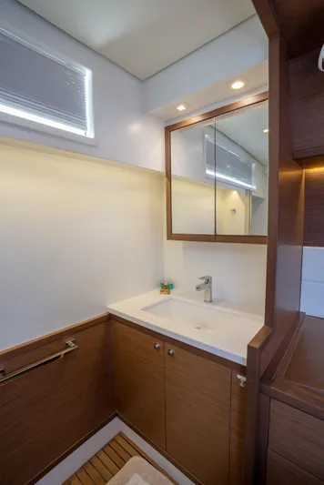 Blue Octane Yacht Photos Pics Luxurious bathroom in 2018 Lagoon 52 F yacht with modern fixtures and wooden cabinetry.