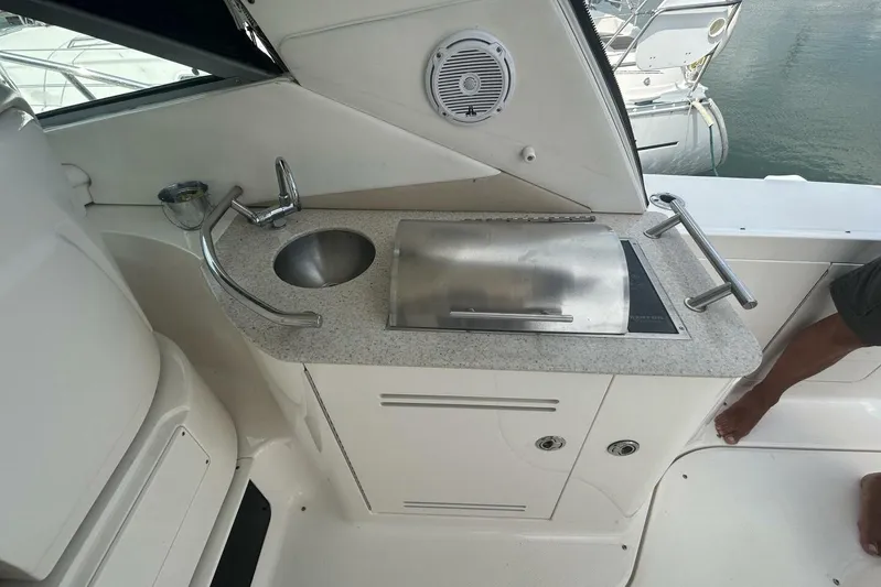  Yacht Photos Pics 2010 Sea Ray 370 Sundancer boat kitchenette with sink and grill.