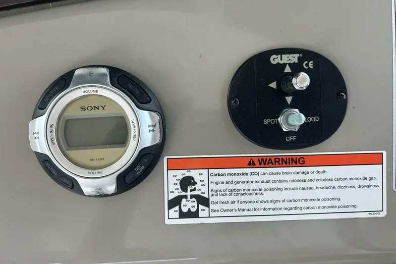  Yacht Photos Pics Sony control panel and warning label on 2010 Sea Ray 370 Sundancer boat dashboard.