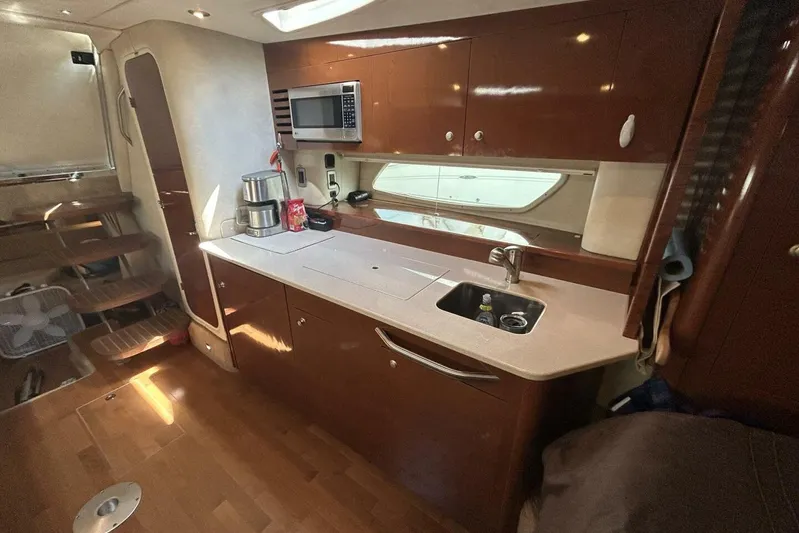  Yacht Photos Pics Interior of 2010 Sea Ray 370 Sundancer yacht, featuring a modern kitchen area.