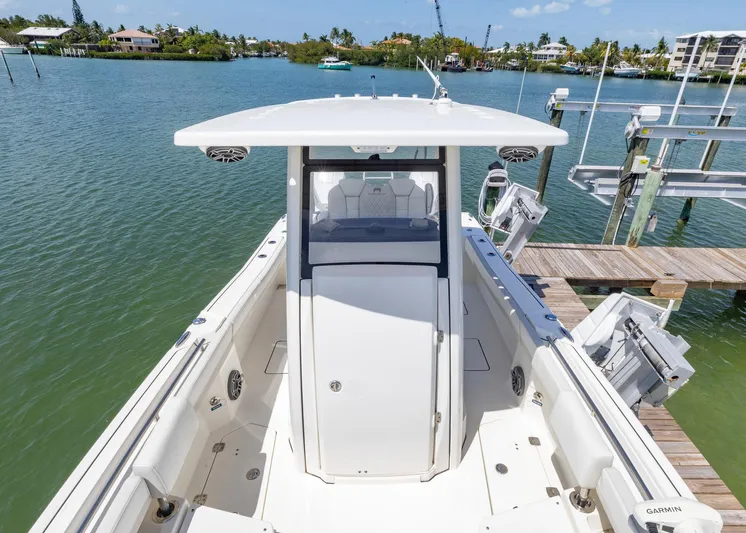 Yacht Photos Pics 2024 World Cat 260CC boat docked in a scenic marina setting.