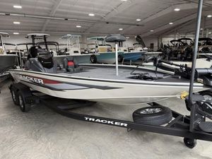 2025 Tracker Savage 215 boat on trailer in showroom, featuring sleek design and modern equipment.