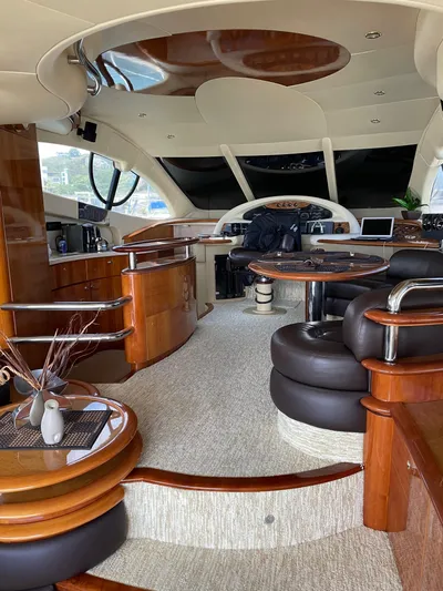 Mercia Yacht Photos Pics Luxurious interior of a 2002 Azimut 55 Flybridge yacht with elegant wood finishes.