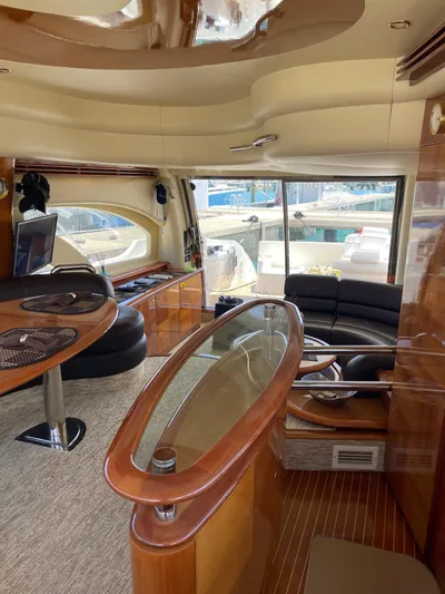 Mercia Yacht Photos Pics Luxurious interior of a 2002 Azimut 55 Flybridge yacht with elegant wood finishes.