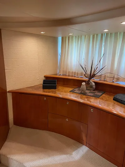 Mercia Yacht Photos Pics Luxurious interior of 2002 Azimut 55 Flybridge yacht with elegant wood cabinetry.