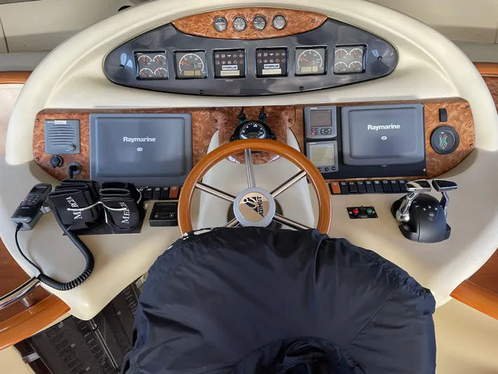 Mercia Yacht Photos Pics Helm of 2002 Azimut 55 Flybridge yacht with Raymarine navigation equipment.