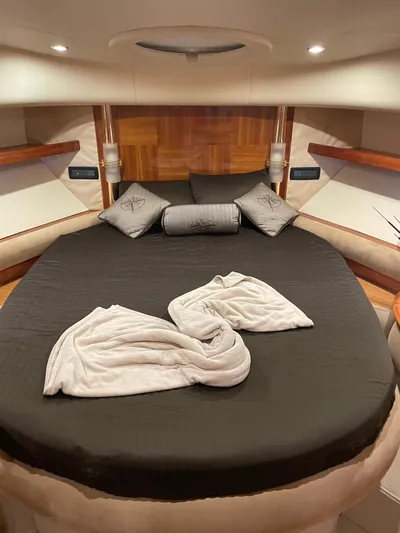 Mercia Yacht Photos Pics Luxurious bedroom interior of 2002 Azimut 55 Flybridge yacht with elegant bedding.