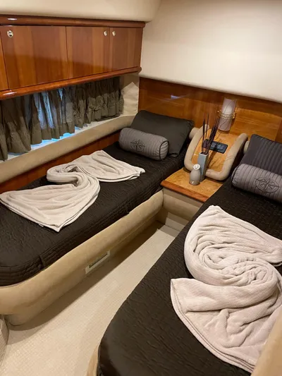 Mercia Yacht Photos Pics Luxurious cabin interior of 2002 Azimut 55 Flybridge yacht with twin beds and elegant decor.