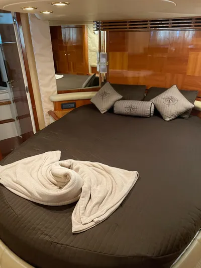 Mercia Yacht Photos Pics Luxurious bedroom interior of 2002 Azimut 55 Flybridge yacht with elegant bedding.