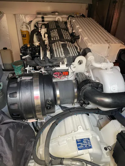 Mercia Yacht Photos Pics Engine compartment of a 2002 Azimut 55 Flybridge yacht, showcasing mechanical components.