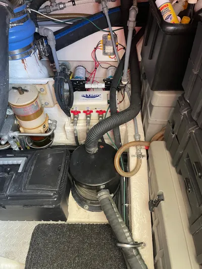 Mercia Yacht Photos Pics Engine room of 2002 Azimut 55 Flybridge yacht, showcasing mechanical components and storage.