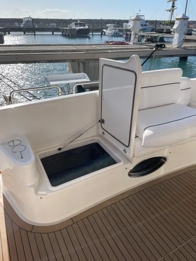 Mercia Yacht Photos Pics 2002 Azimut 55 Flybridge yacht with open storage compartment, docked at marina.