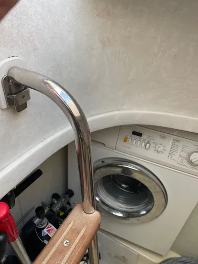 Mercia Yacht Photos Pics Laundry area inside 2002 Azimut 55 Flybridge yacht with washing machine.