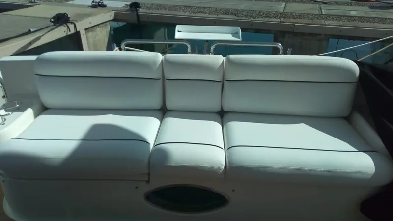 Mercia Yacht Photos Pics White leather seating on 2002 Azimut 55 Flybridge yacht, dockside view.