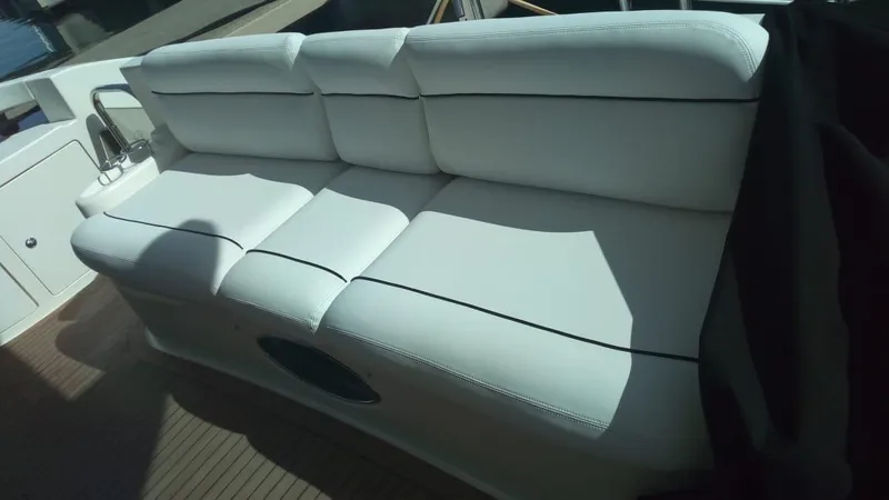 Mercia Yacht Photos Pics White leather seating on 2002 Azimut 55 Flybridge yacht deck.