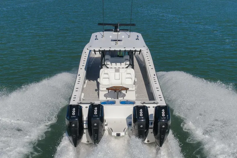  Yacht Photos Pics 2023 Freeman 43 boat with four powerful engines cruising on open water.