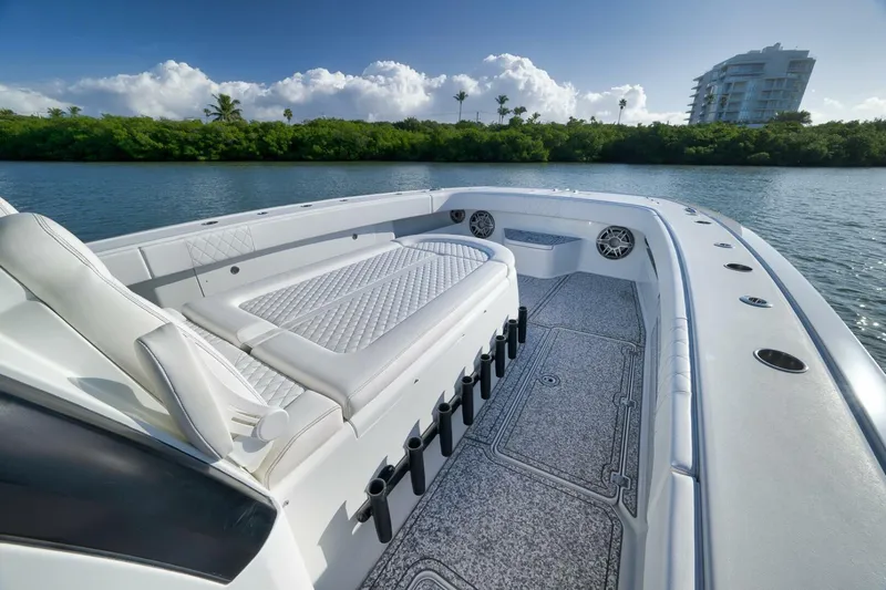  Yacht Photos Pics Luxurious 2023 Freeman 43 boat interior with plush seating, scenic waterfront view.