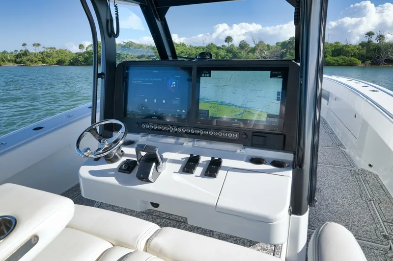  Yacht Photos Pics Helm of 2023 Freeman 43 boat with navigation screens and steering wheel.