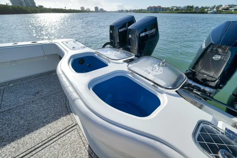  Yacht Photos Pics 2023 Freeman 43 boat with Mercury engines and livewell, on a sunny waterway.