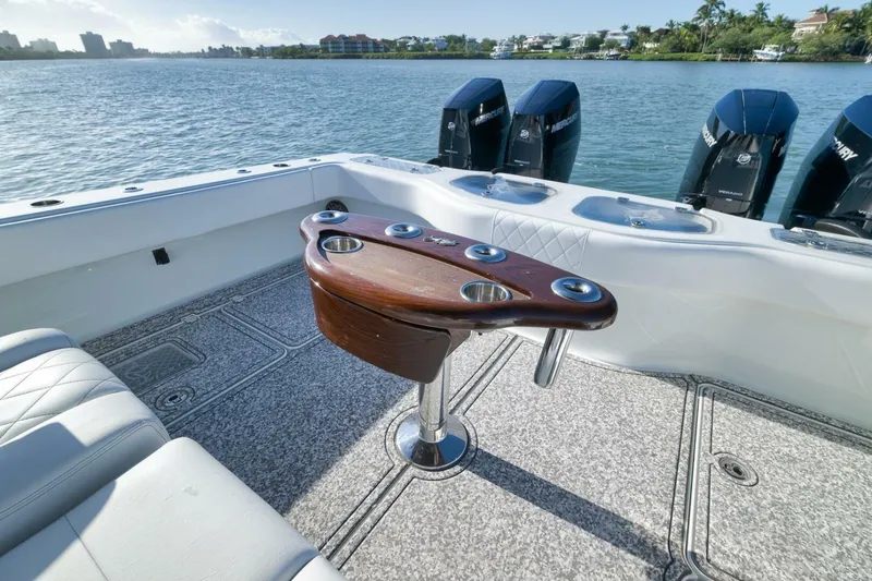  Yacht Photos Pics Luxury Freeman 43 boat interior with fishing rod holders, 2023 model, on a scenic waterway.