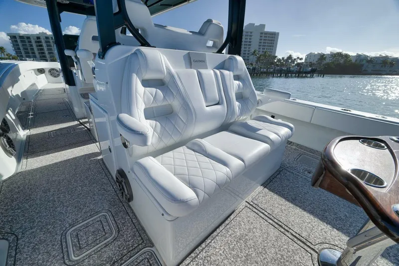  Yacht Photos Pics Luxurious seating on 2023 Freeman 43 boat with waterfront view.