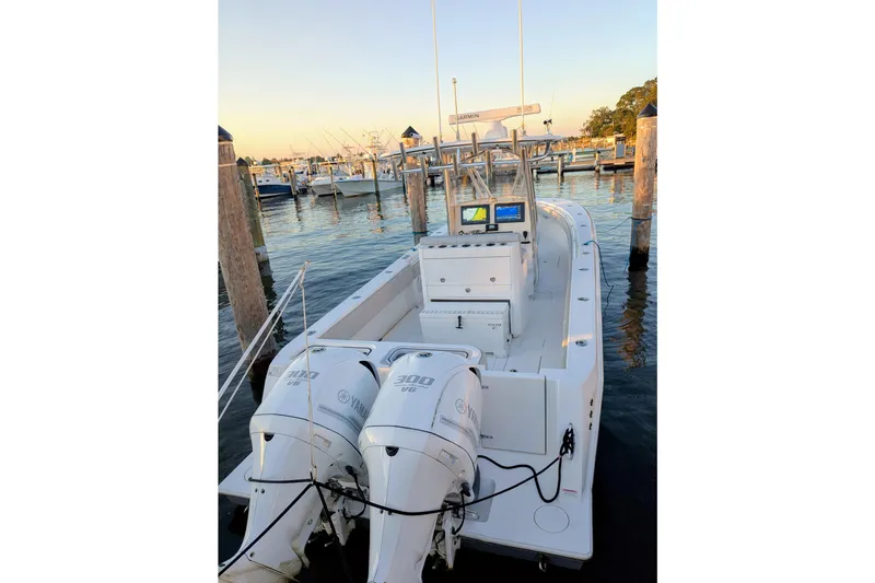  Yacht Photos Pics 2017 Contender 32 ST boat docked with dual Yamaha 300 engines, featuring advanced navigation systems.