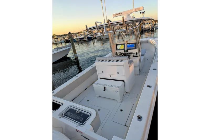  Yacht Photos Pics 2017 Contender 32 ST boat interior with navigation equipment at marina dock.