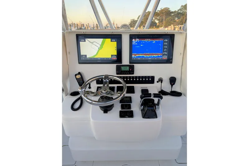  Yacht Photos Pics Helm of 2017 Contender 32 ST boat with dual navigation screens and controls.