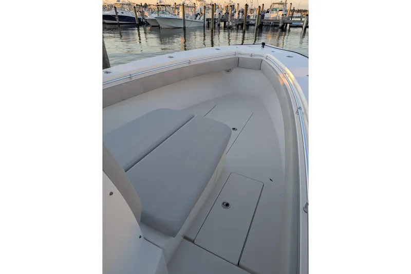  Yacht Photos Pics 2017 Contender 32 ST boat interior with cushioned seating and storage compartments.
