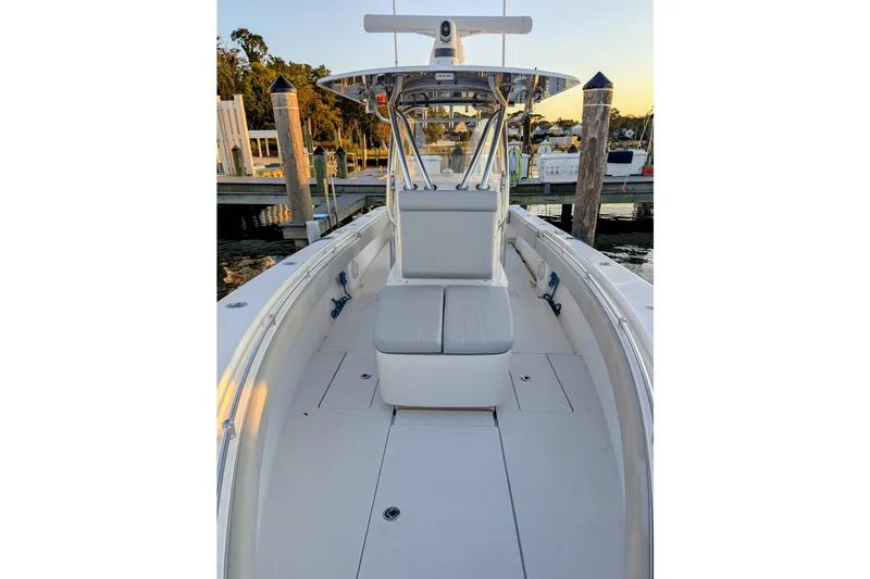  Yacht Photos Pics 2017 Contender 32 ST boat docked, showcasing spacious deck and seating area.